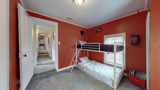 bedroom featuring carpet flooring and ornamental molding