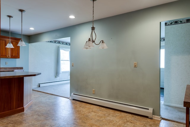 kitchen featuring decorative light fixtures, an inviting chandelier, and a baseboard heating unit