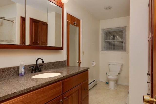 bathroom with vanity, a baseboard radiator, and toilet