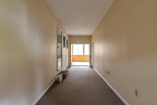 hallway featuring light carpet