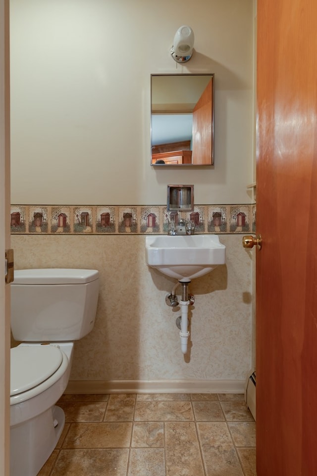 bathroom with toilet and sink