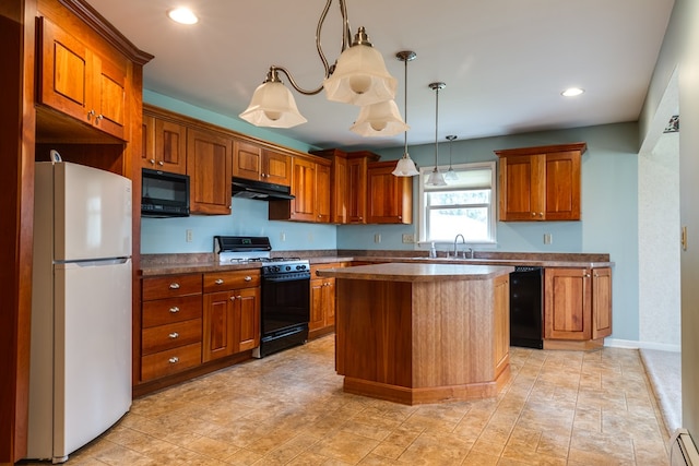 kitchen with sink, a baseboard radiator, decorative light fixtures, a kitchen island, and black appliances