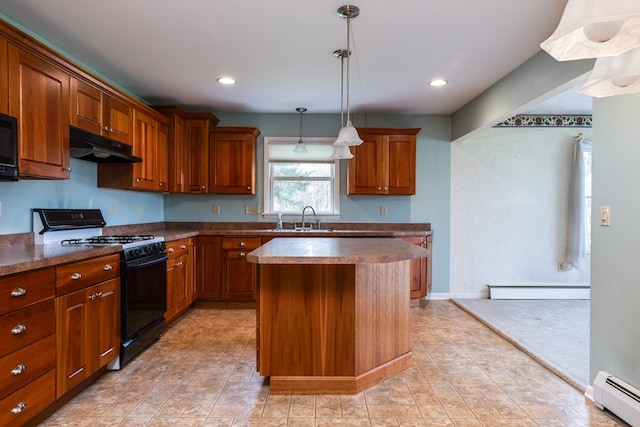 kitchen with black appliances, a kitchen island, hanging light fixtures, and a baseboard heating unit