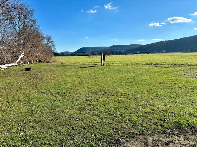 mountain view featuring a rural view