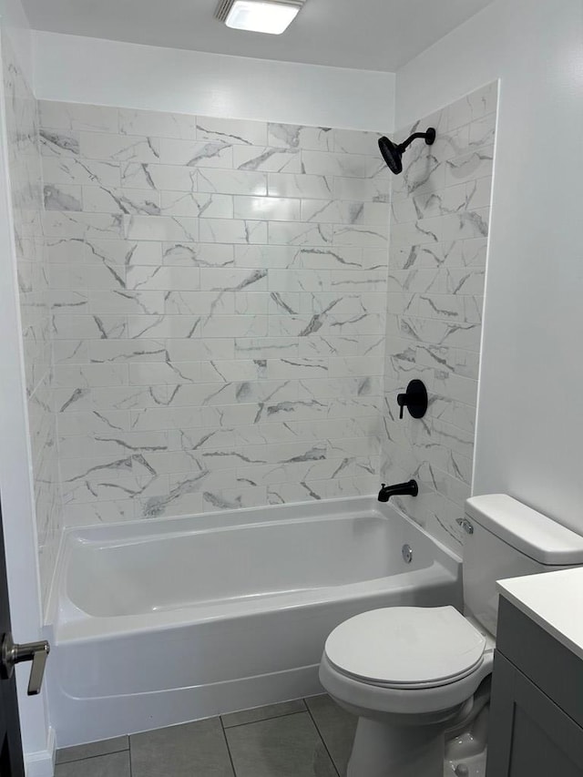 full bathroom with tile patterned flooring, vanity, toilet, and tiled shower / bath