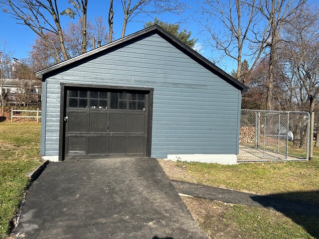 garage with a yard