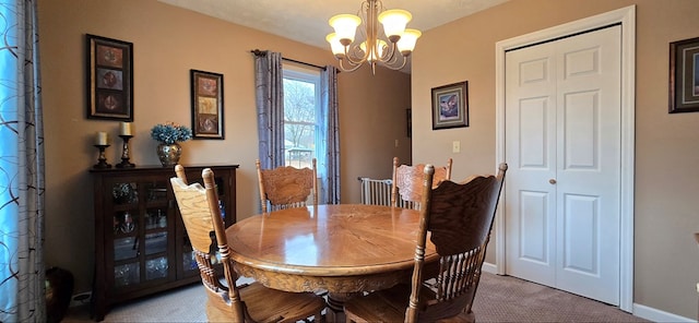 carpeted dining area with a notable chandelier