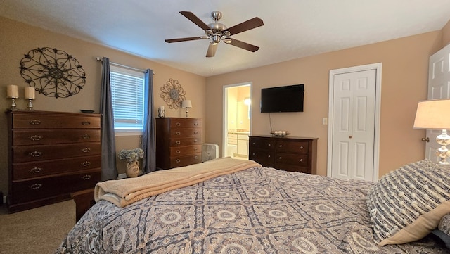 carpeted bedroom featuring ceiling fan and connected bathroom