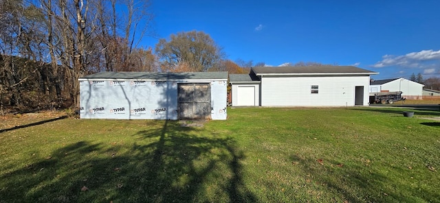 view of outdoor structure featuring a lawn