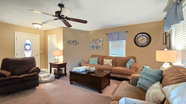 living room with light carpet and ceiling fan