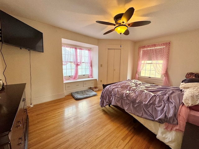 bedroom featuring ceiling fan and light hardwood / wood-style floors