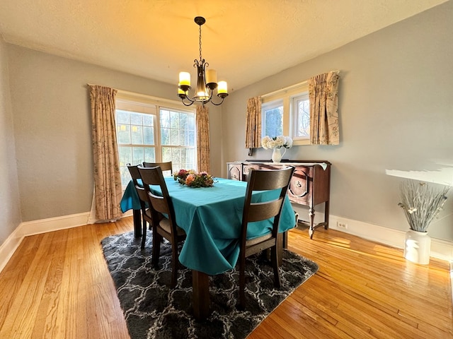 dining room featuring a chandelier and hardwood / wood-style floors