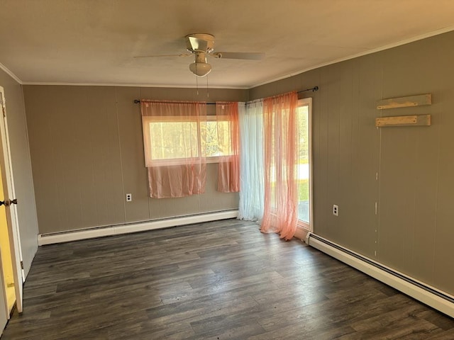 unfurnished room featuring dark hardwood / wood-style flooring, crown molding, a baseboard radiator, and ceiling fan