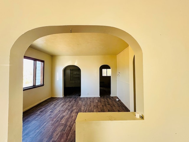 spare room featuring dark hardwood / wood-style floors