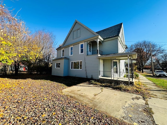 view of property exterior with a porch