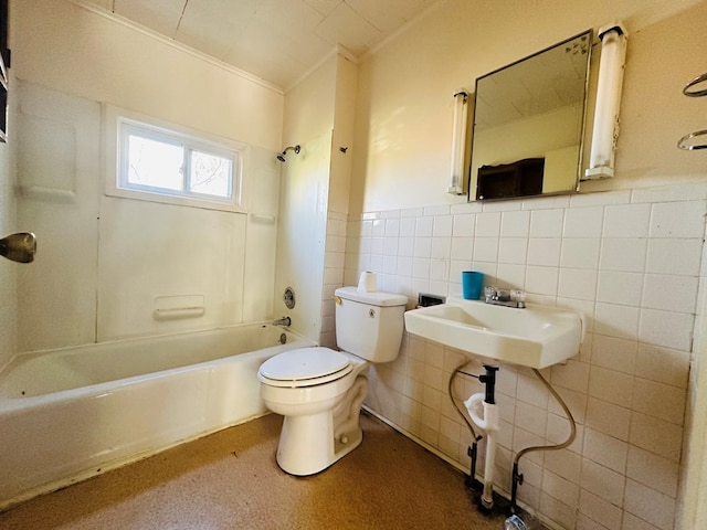 full bathroom with toilet, sink,  shower combination, tile walls, and ornamental molding