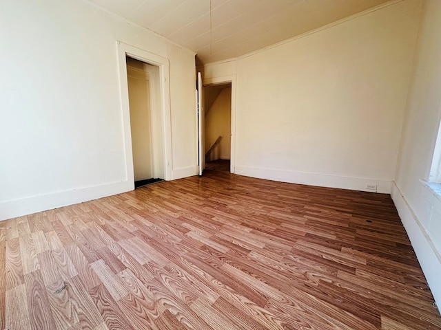 spare room featuring hardwood / wood-style floors