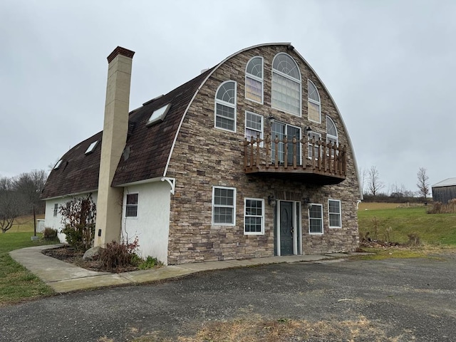 view of front of home with a balcony