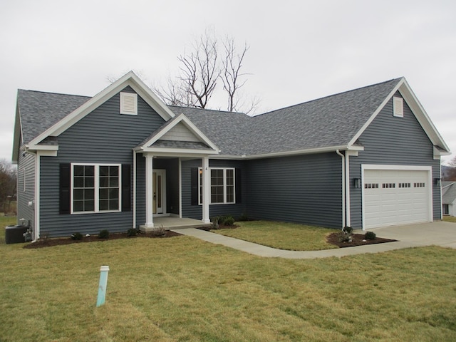 view of front of home with a garage and a front yard