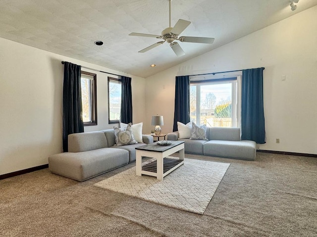 living room with lofted ceiling, carpet floors, and ceiling fan