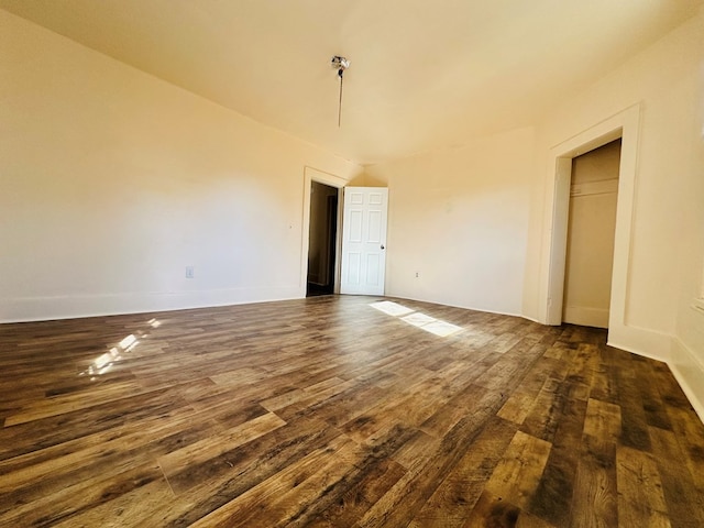 spare room featuring dark hardwood / wood-style floors