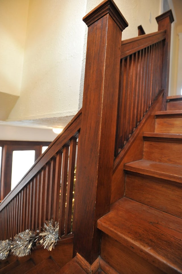 staircase featuring wood-type flooring