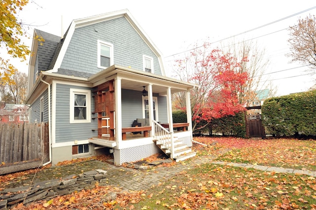 back of house with a porch