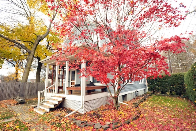 exterior space featuring a wooden deck and covered porch