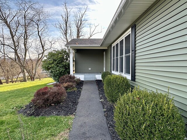 view of property exterior featuring a yard