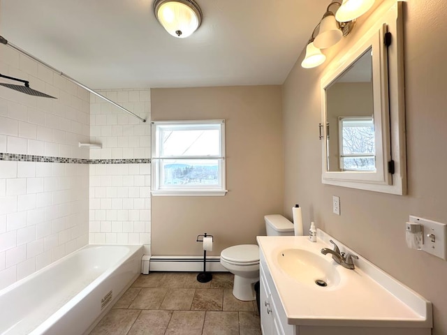 full bathroom featuring vanity, a baseboard heating unit, toilet, and a healthy amount of sunlight