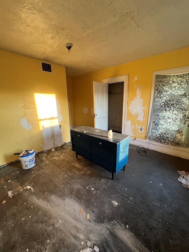 interior space with a textured ceiling