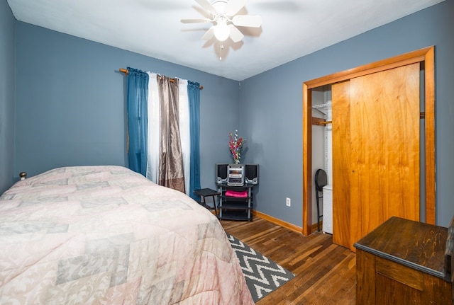 bedroom with a closet, ceiling fan, and dark wood-type flooring