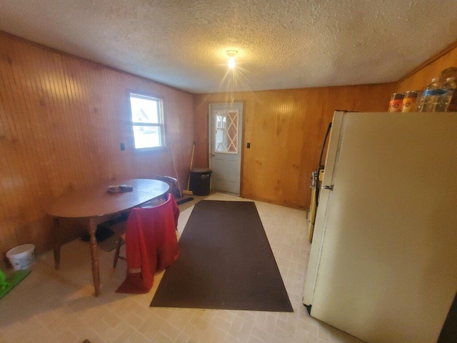 dining room with a textured ceiling