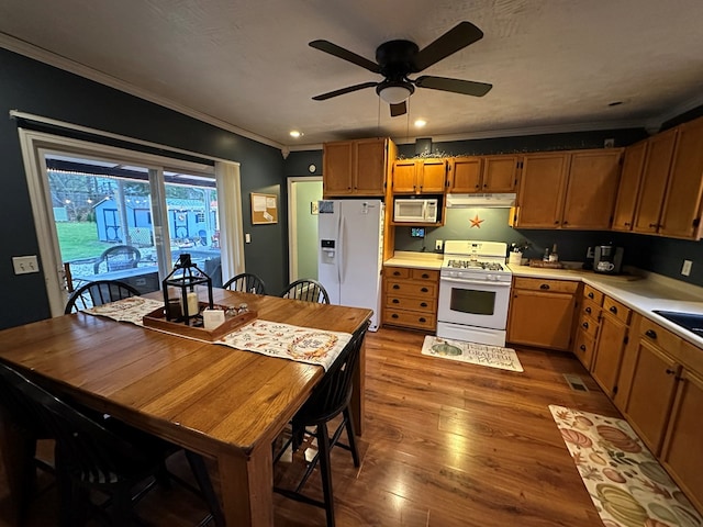 kitchen with ceiling fan, sink, crown molding, hardwood / wood-style floors, and white appliances