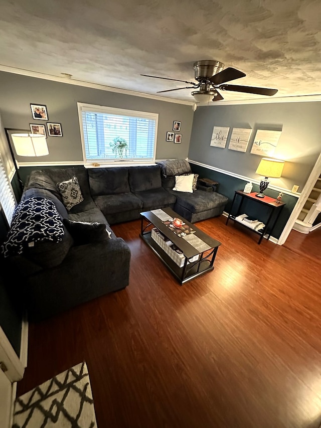 living room featuring ceiling fan, wood-type flooring, and crown molding