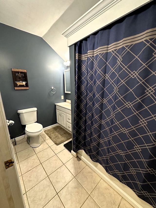 bathroom with curtained shower, tile patterned flooring, lofted ceiling, toilet, and vanity