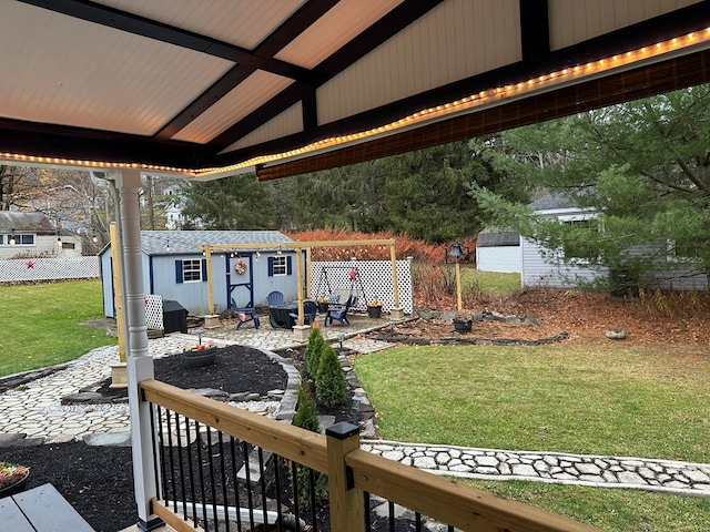 view of yard featuring a patio area and an outbuilding