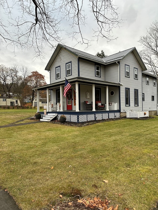 view of front of house featuring covered porch and a front yard