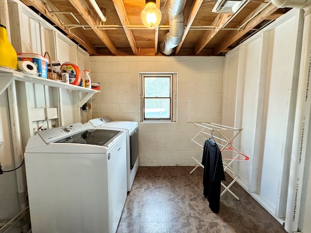 clothes washing area featuring independent washer and dryer