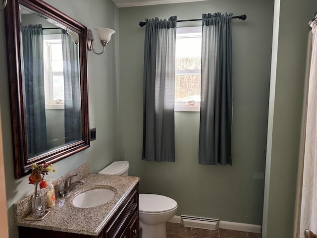 bathroom featuring tile patterned floors, plenty of natural light, toilet, and vanity