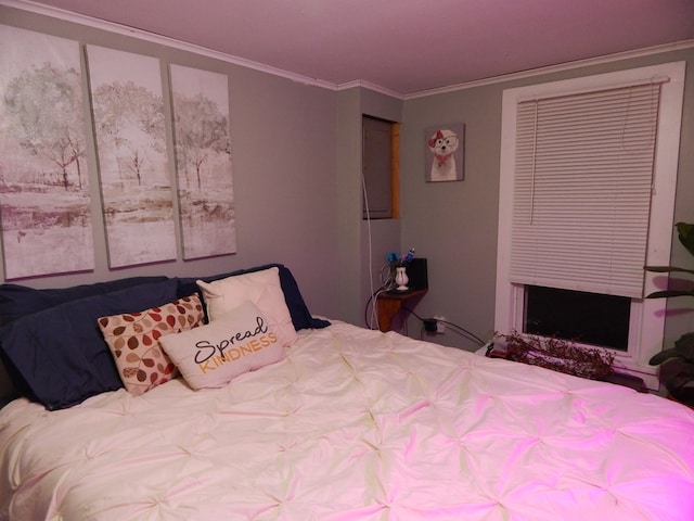 bedroom with ornamental molding