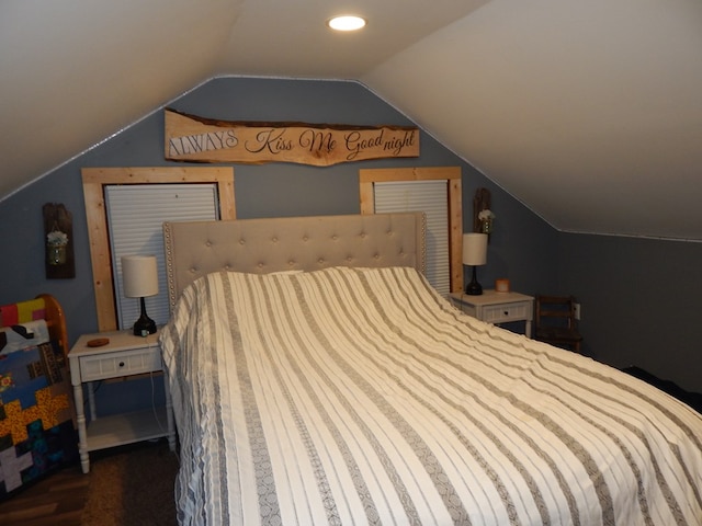 bedroom with lofted ceiling