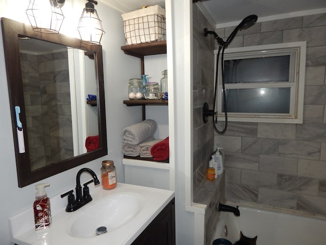 bathroom featuring vanity and tiled shower / bath combo