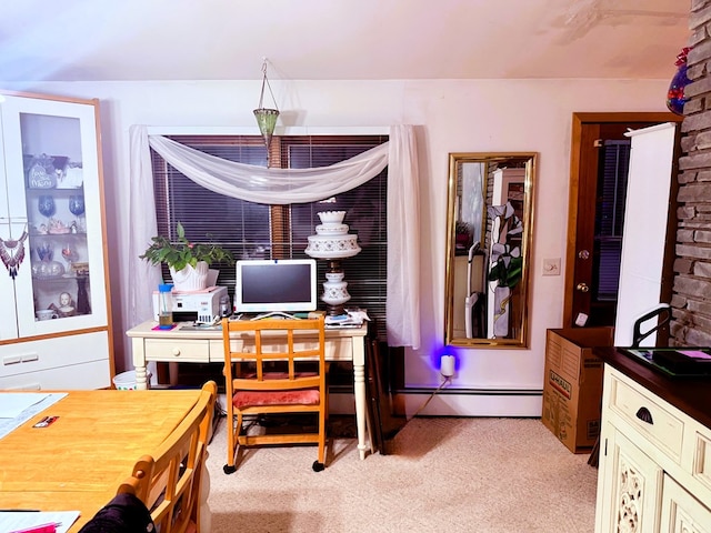 office space featuring light carpet and a baseboard radiator