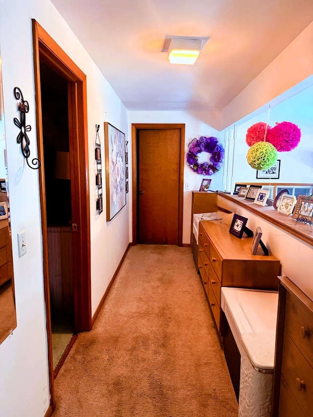 hallway with light colored carpet