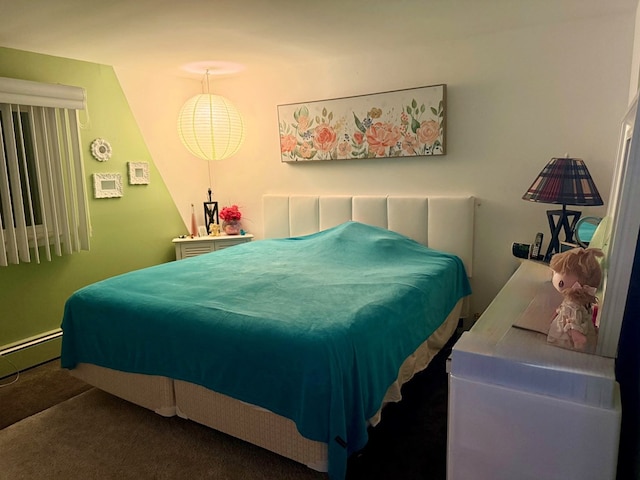 carpeted bedroom with a baseboard radiator