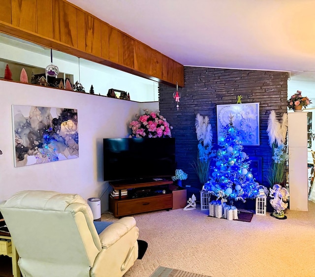 carpeted living room featuring vaulted ceiling