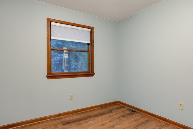 empty room featuring hardwood / wood-style floors