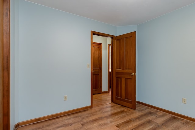 unfurnished room with light hardwood / wood-style floors