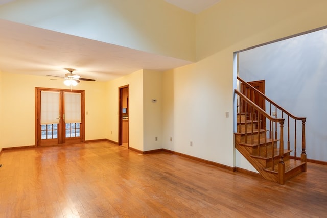 interior space featuring ceiling fan, french doors, and wood-type flooring